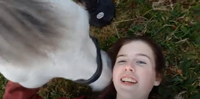 Rose Burgham, UK, meditating with her horse.