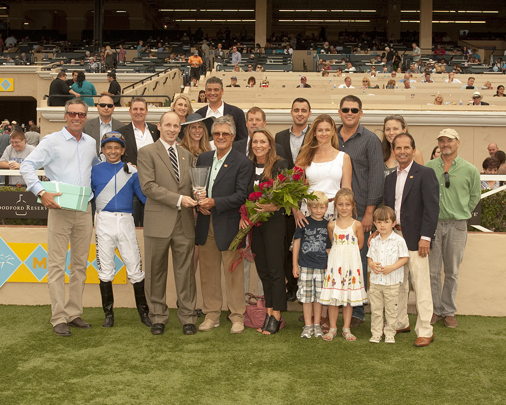 Cornier (blue jacket, holding the trophy) after Points Offthebench’s Bing Crosby victory at Del Mar | Benoit photo Cornier (blue jacket, holding the trophy) after Points Offthebench’s Bing Crosby victory at Del Mar | Benoit photo