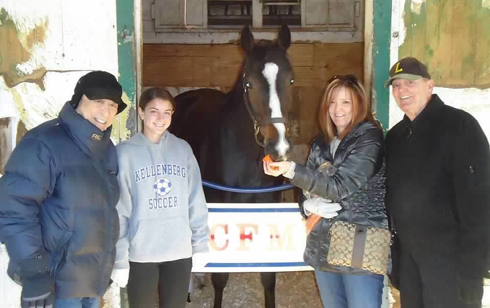 Breeder Donald Newman (far left) and family with Eye Luv Lulu