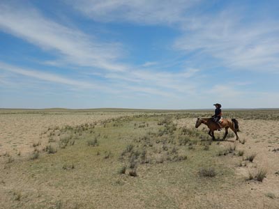 The author, Jenna Arnett riding the Gobi Desert The author, Jenna Arnett riding the Gobi Desert