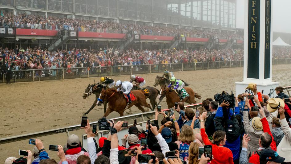 Justify (number 7) held off Bravazo at the wire to win the 2018 Preakness Stakes en route to becoming horse racing's 13th Triple Crown winner. (Eclipse Sportswire)