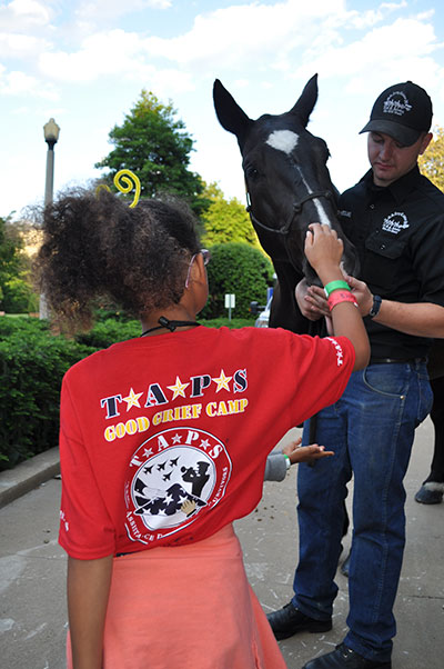  Klinger greets a TAPS family member at the Pentagon tour, May 22, 2015, courtesy of TAPS 